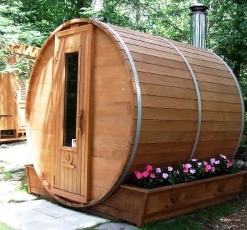 Image of a charming barrel sauna in an outdoor setting