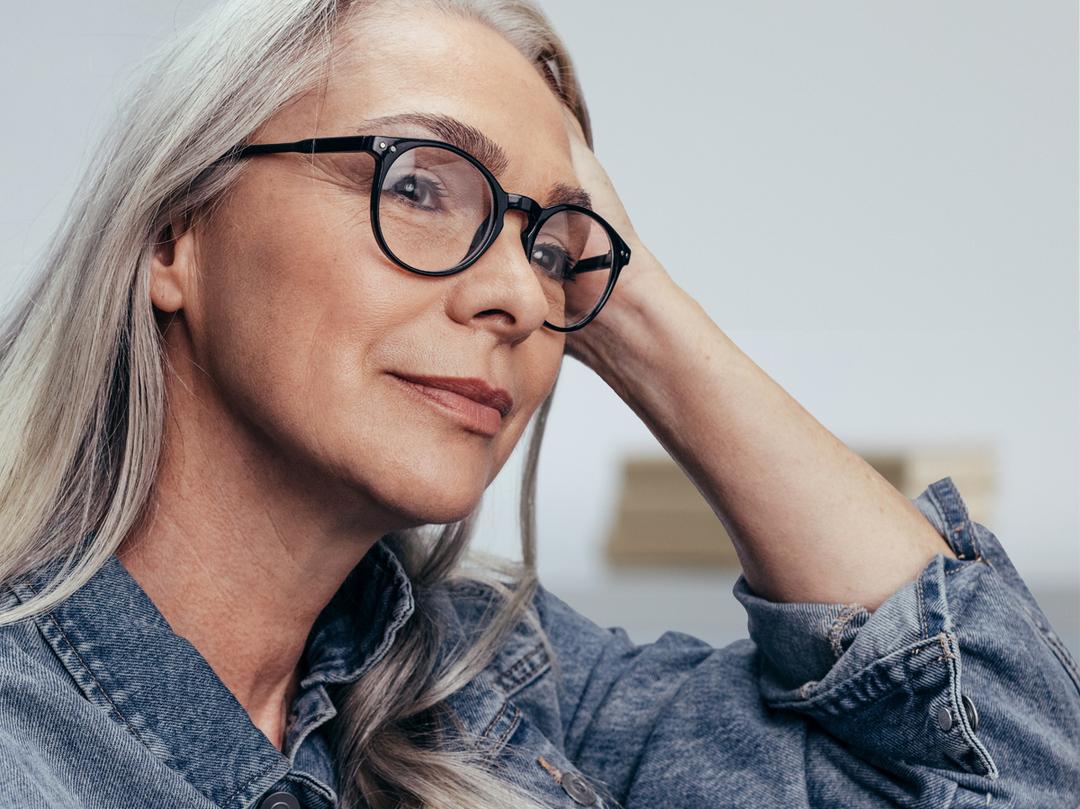 Older woman thinking and looking off camera