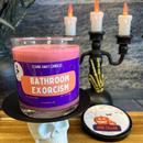 A dark red bathroom exorcism stank away halloween candle on a spooky halloween background