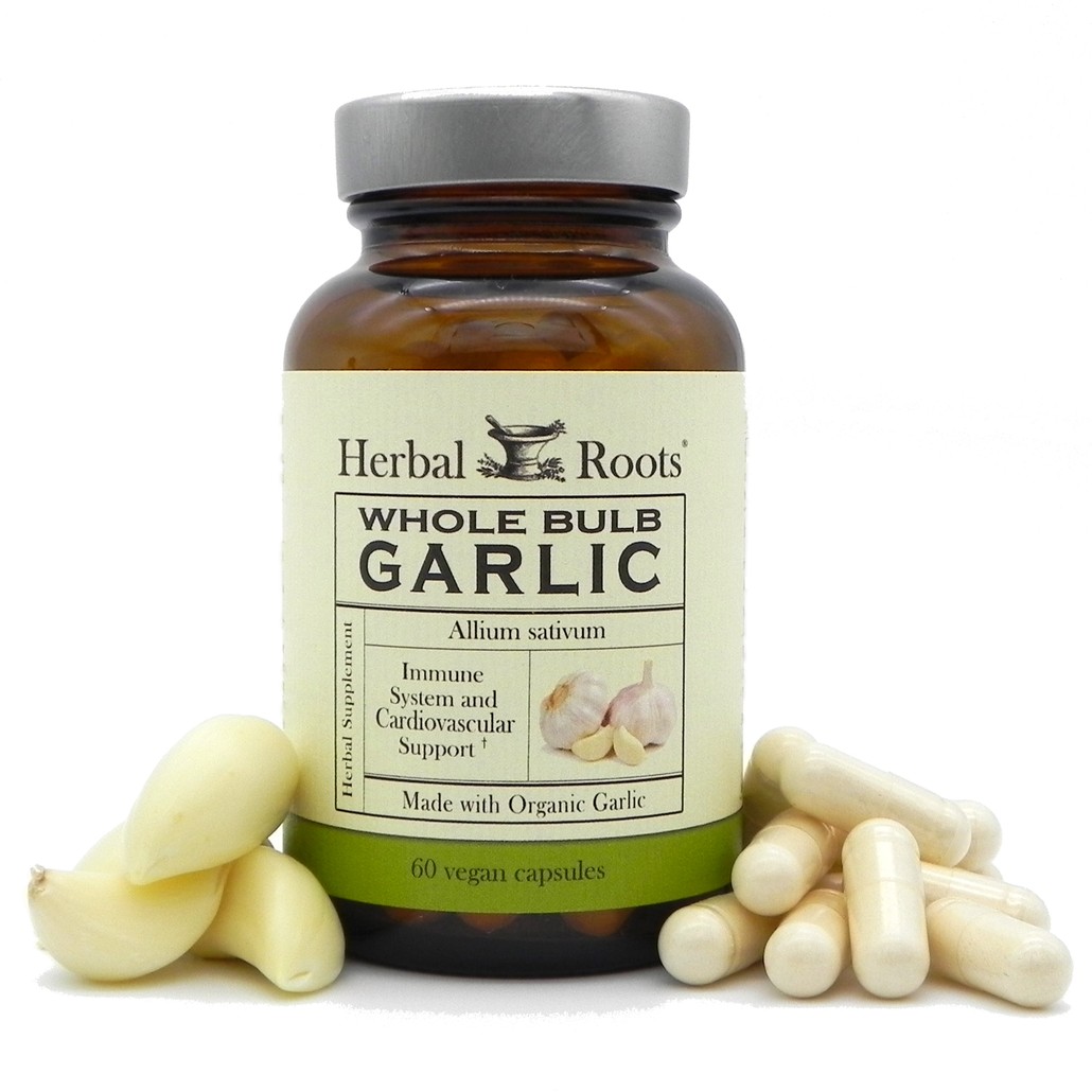 Herbal Roots Garlic bottle with pills and garlic cloves