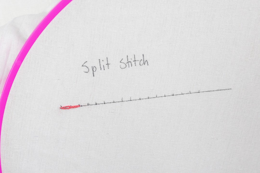 A needle splits the first stitch, creating a second one.
