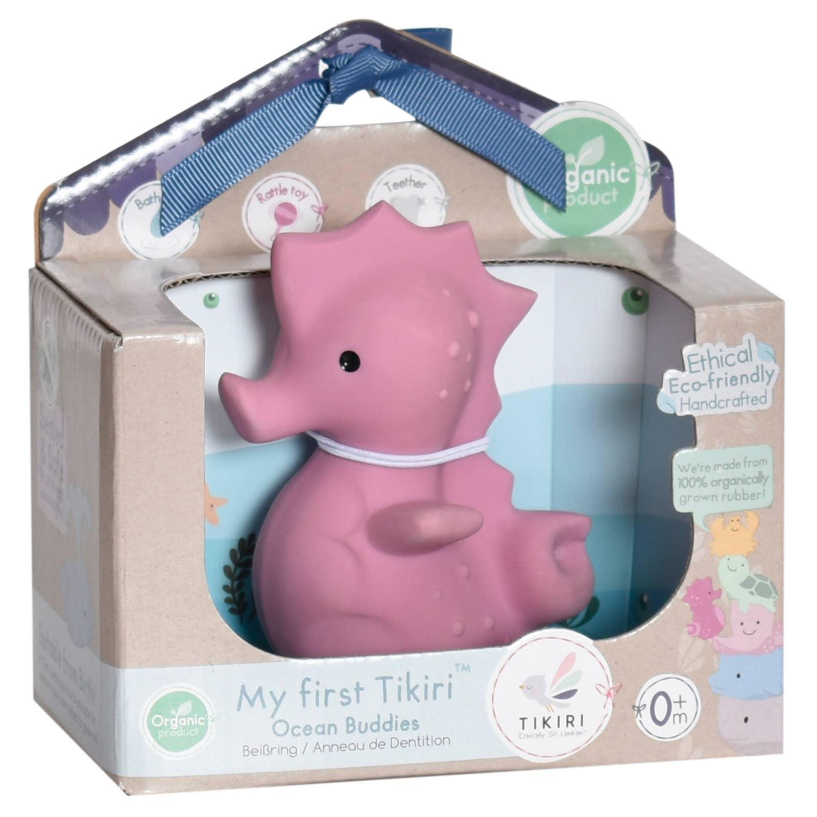Baby sleeping with pink octopus toy