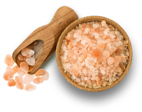 A bowl of Himalayan rock salt surrounded by floral artworks