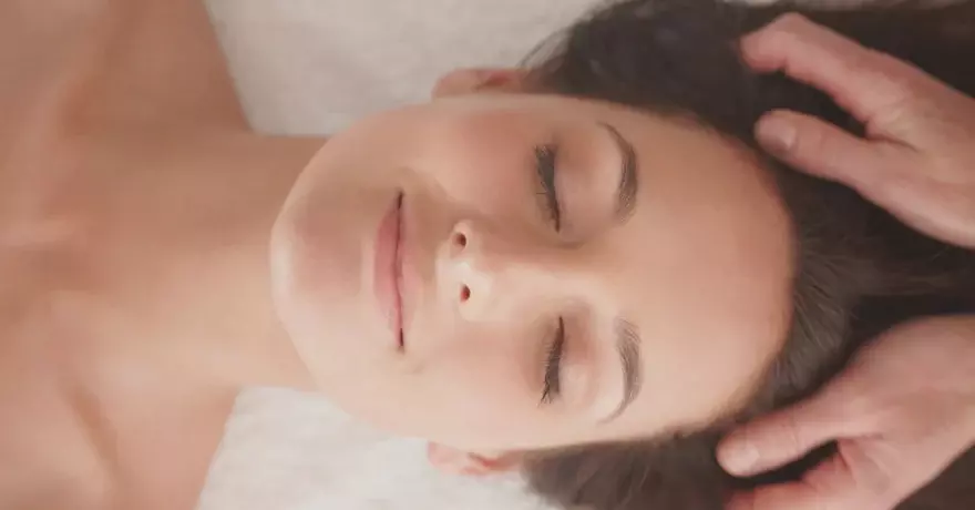 woman getting head massaged