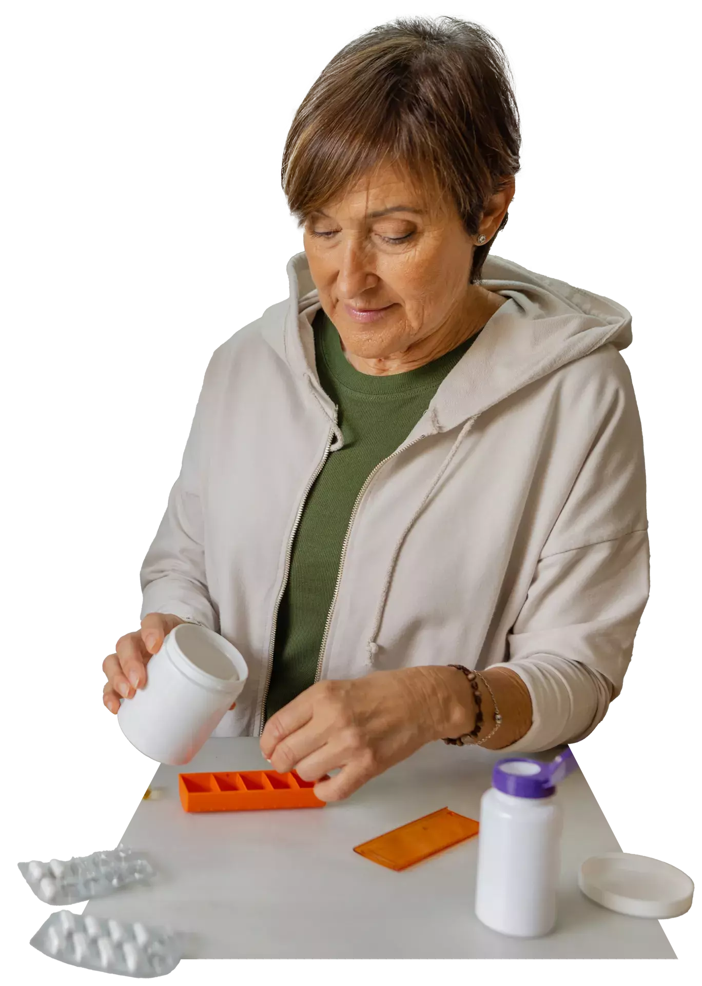 Woman filling her pill box