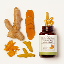 Bottle of herbal roots turmeric curcumin on its side with capsules spilling out. Next to the bottle are neatly laid out variations of raw turmeric. Whole turmeric root, slices of root, shavings of roots and peeled root.