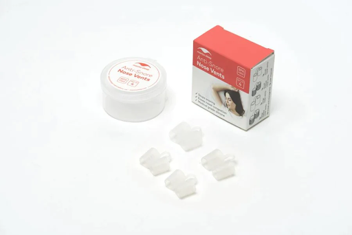 Four sets of clear nose vents, a round plastic container, and a box.