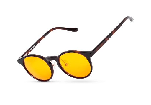 A pair of amber-colored blue light blocking glasses.