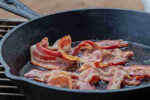 bacon sizzling in pan fat fats
