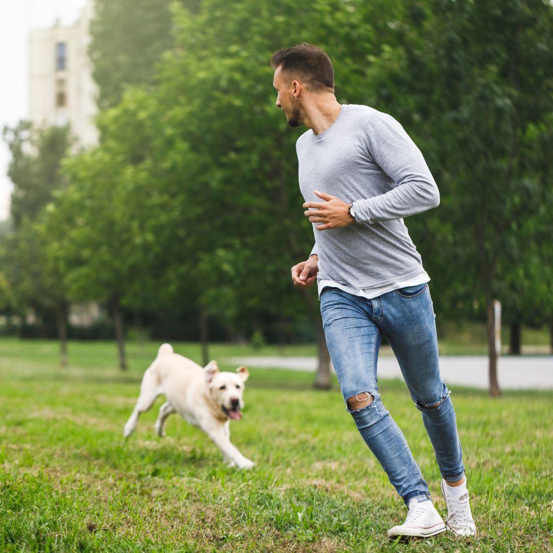 Man running from dog