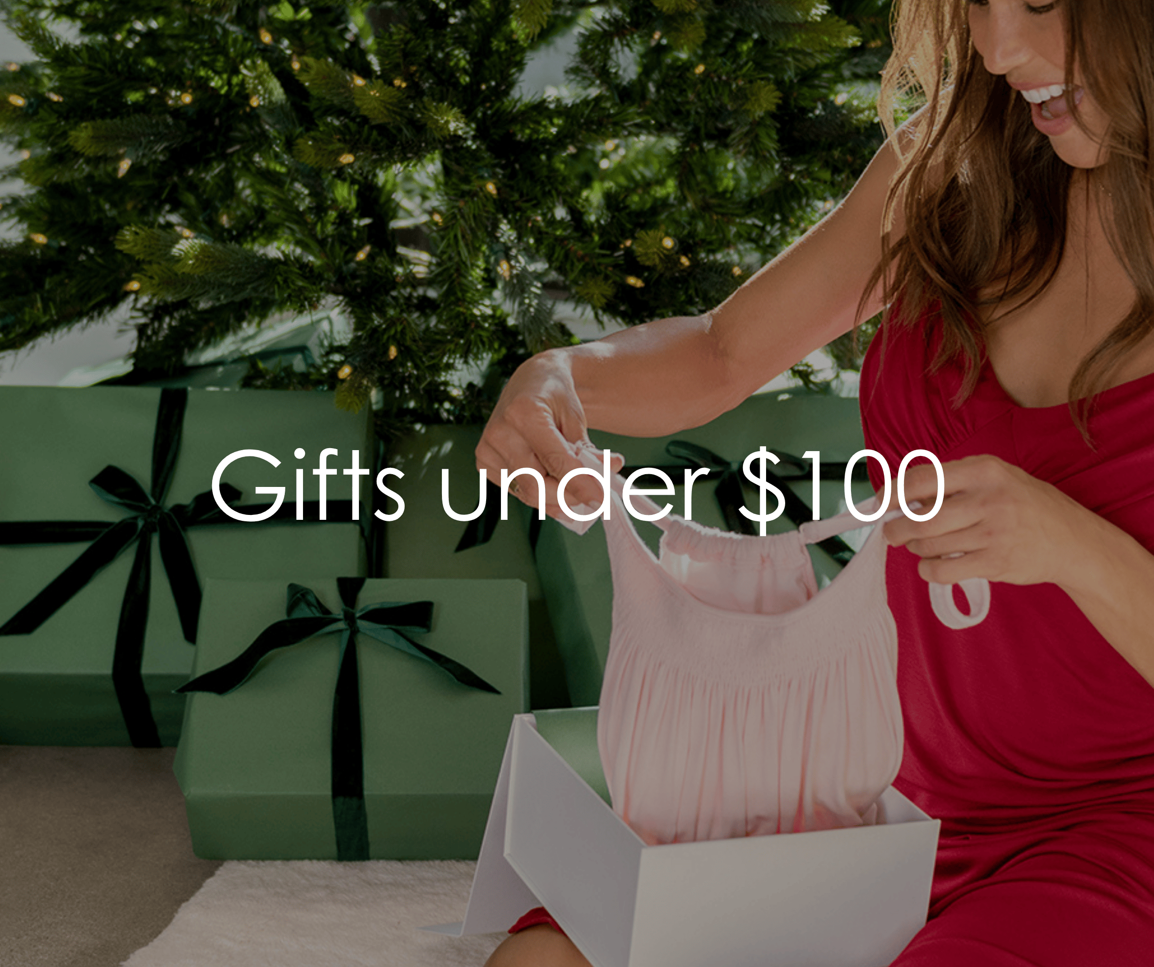 Female wearing red and holding gift box