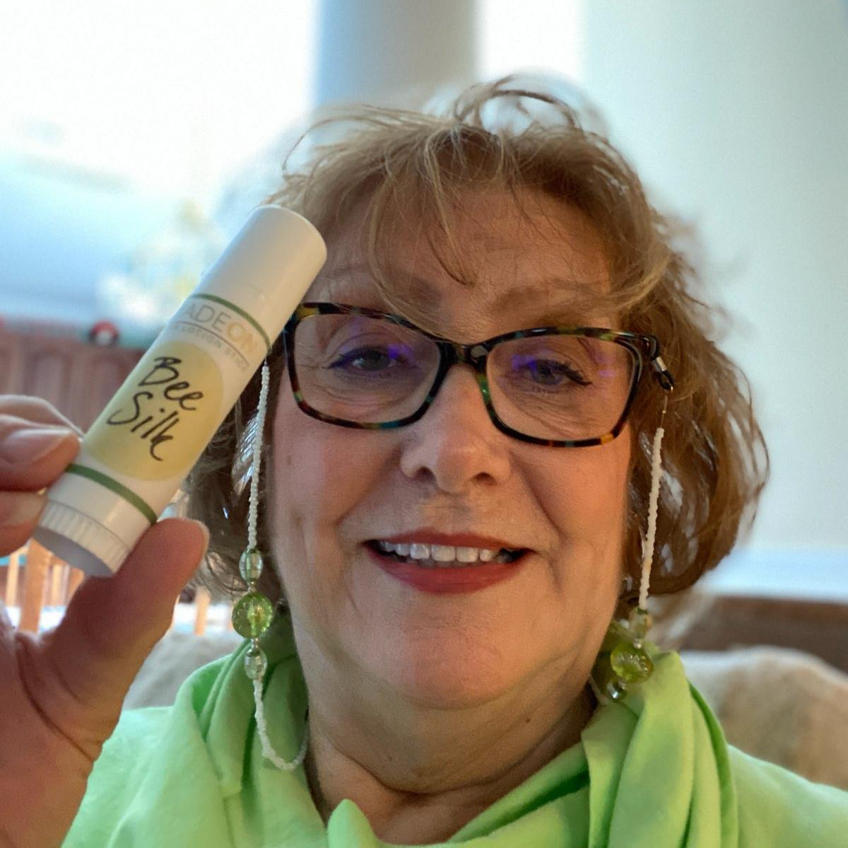 customer showing beesilk lotion stick