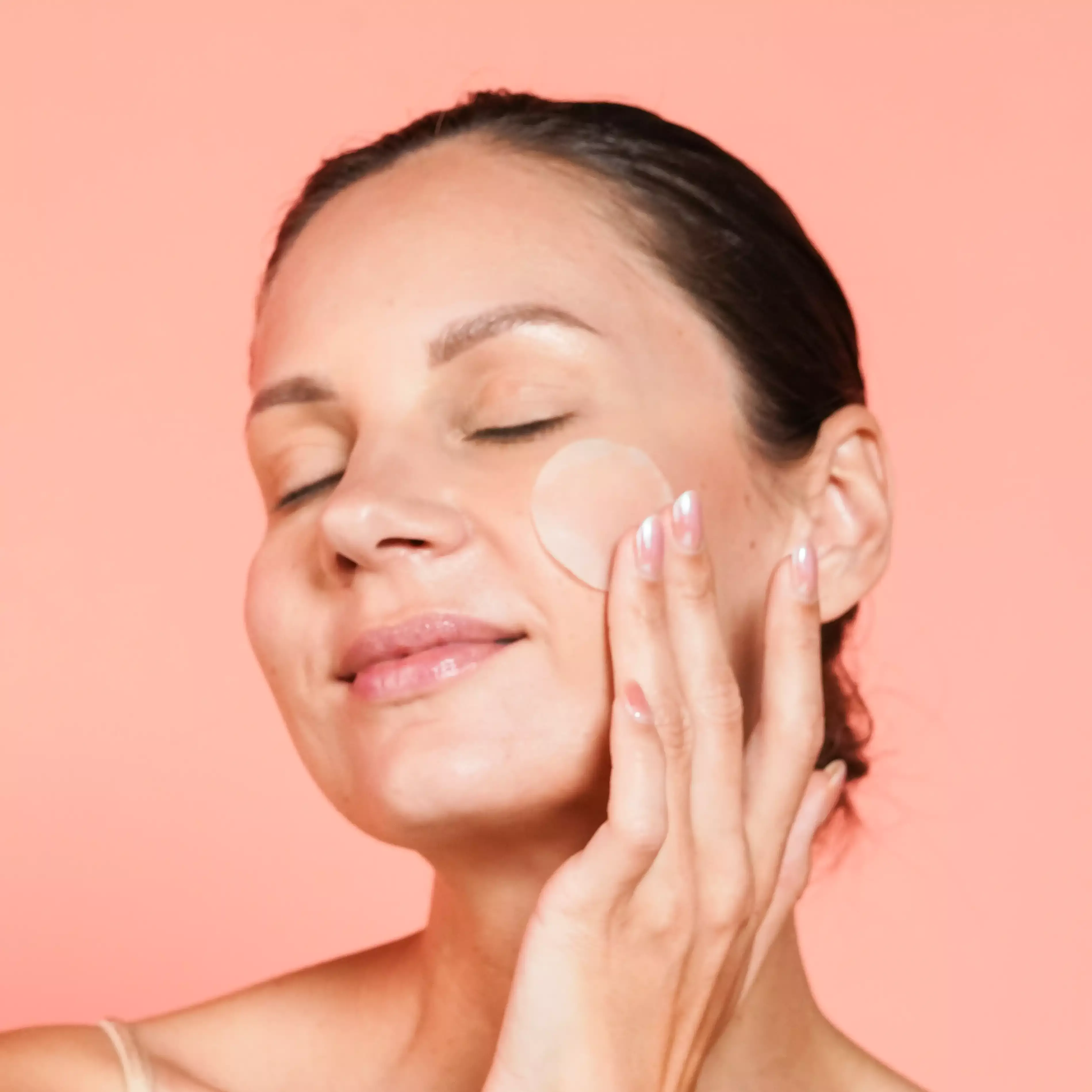Woman with Dim n Dazzle Dark spot Patch on her face