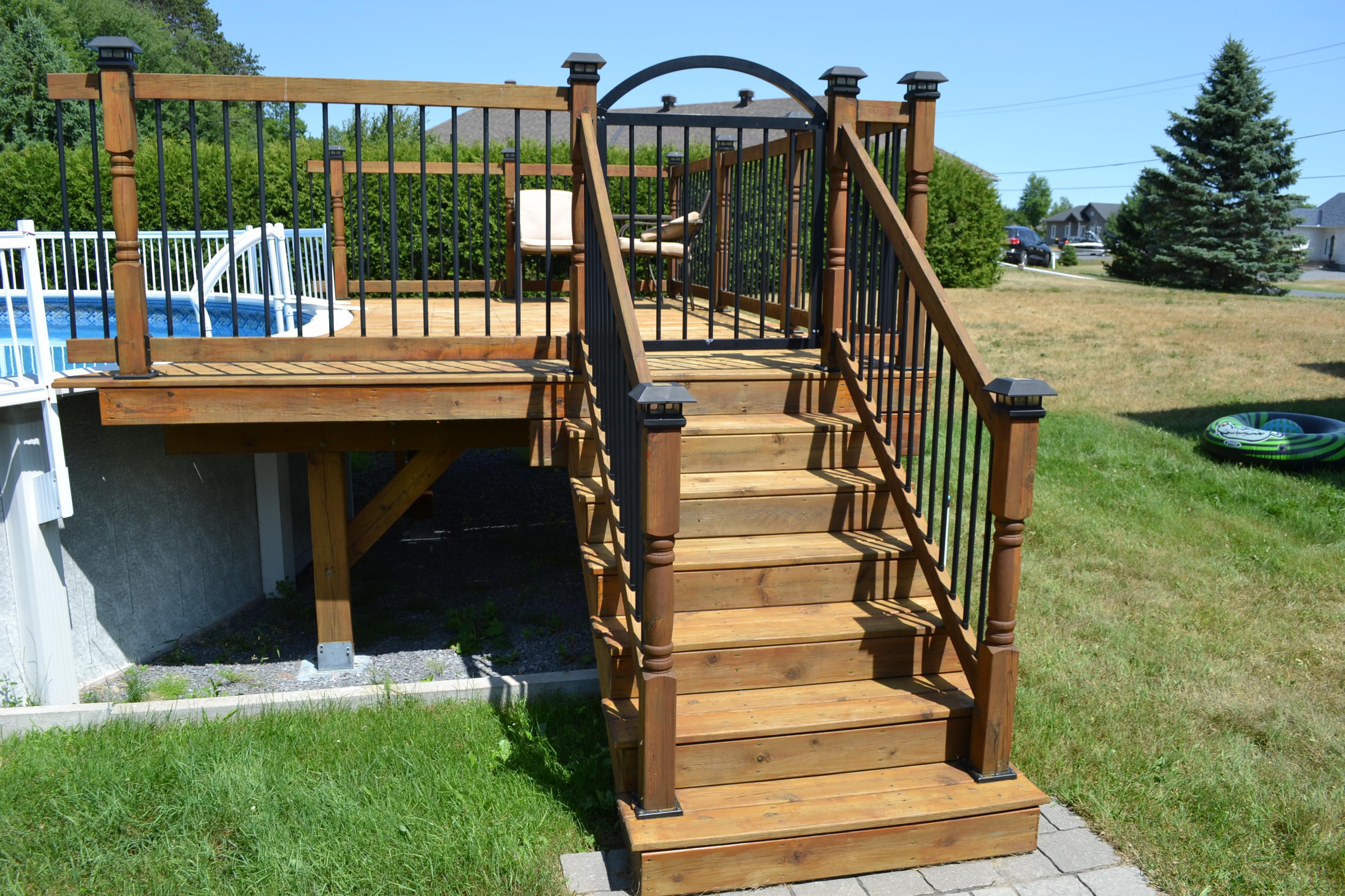 image of a floating deck beside an out of ground pool in a backyard