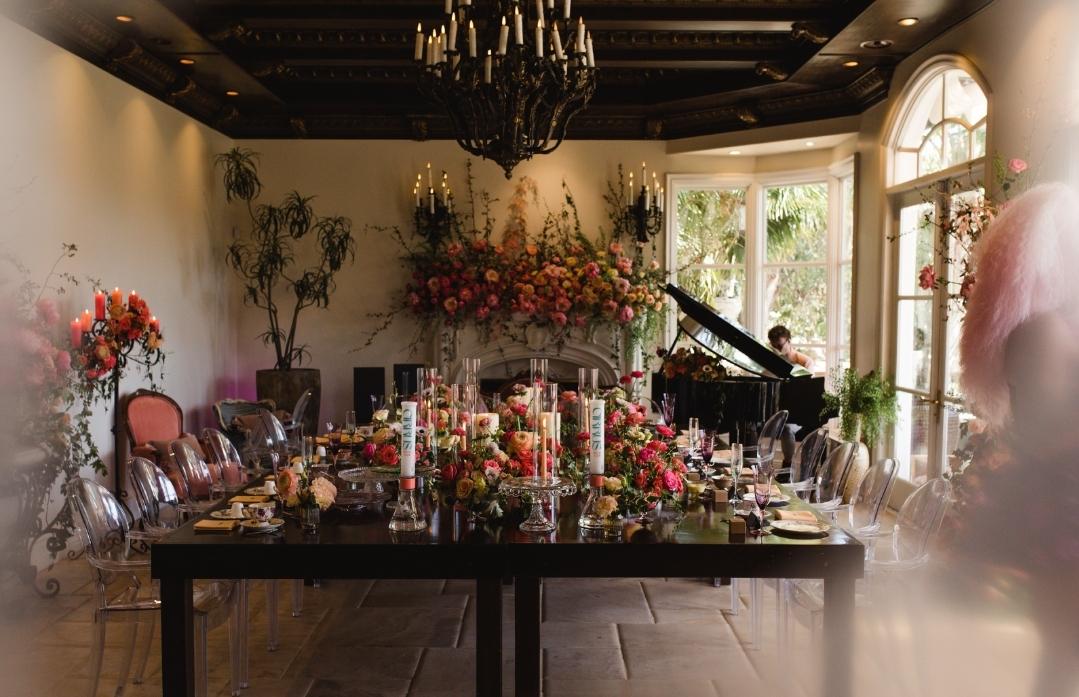 A luxurious banquet at Cirrus Social Club in Colorado featuring several Prism Modular Bongs displayed as elegant centerpieces amongst flowers and chandeliers, showcasing the best value glass and durable glass water pipe quality for an elevated event.