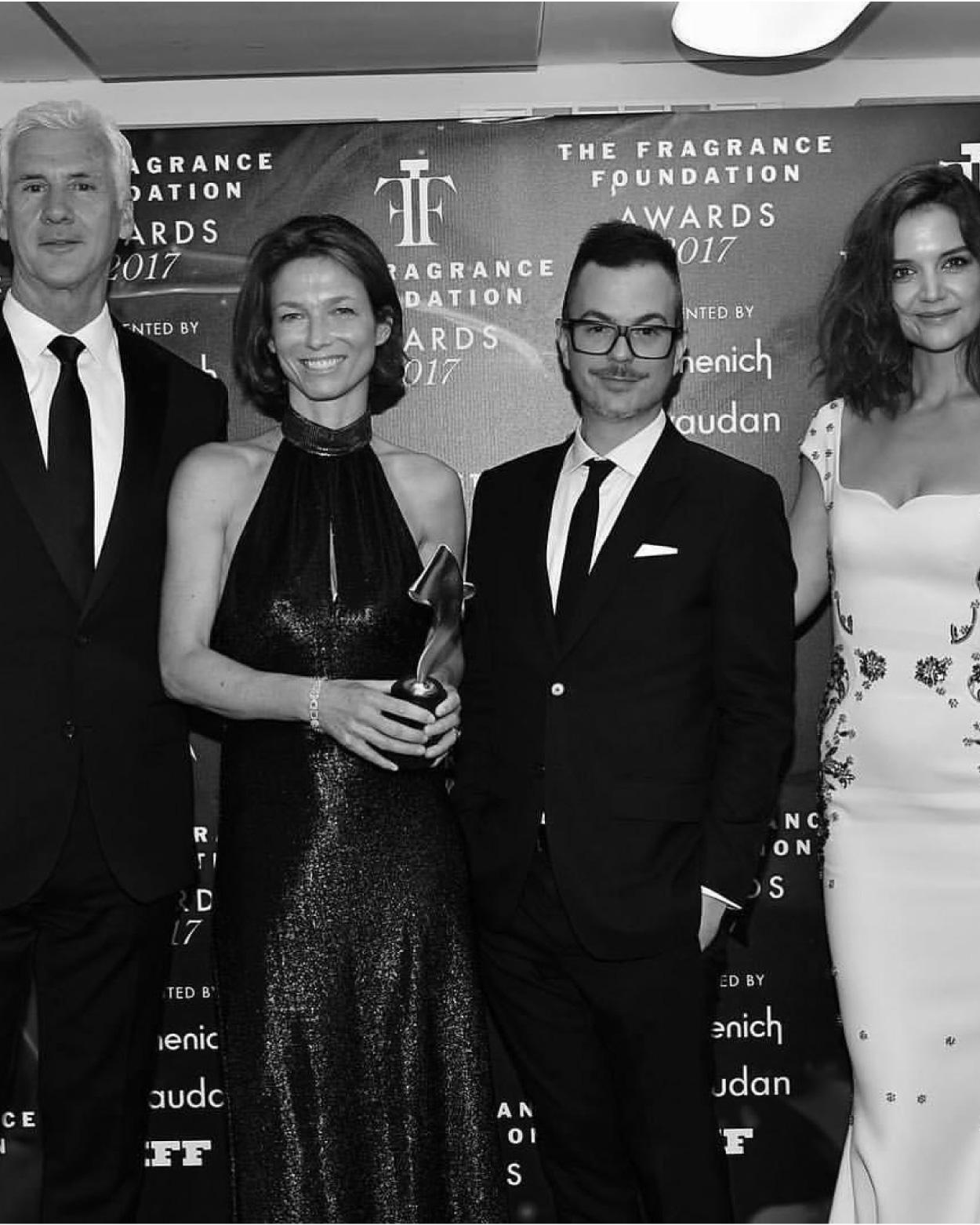 Perfumers David Apel and Emilie Coppermann and Joseph Quartana accept the Perfume Extraordinaire Aware for Poppy Soma from Katie Holmes