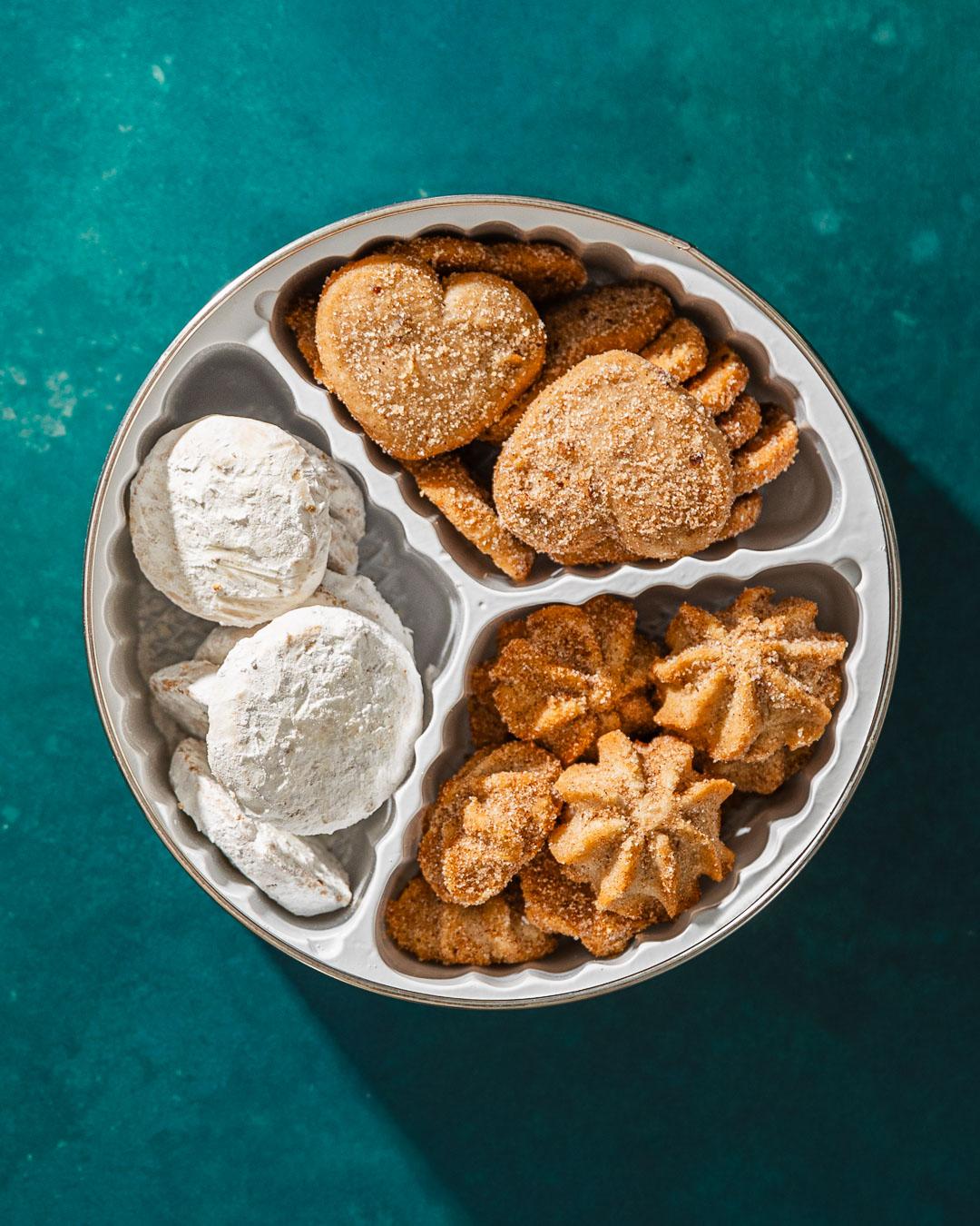 three types of mexican cookies in small tin