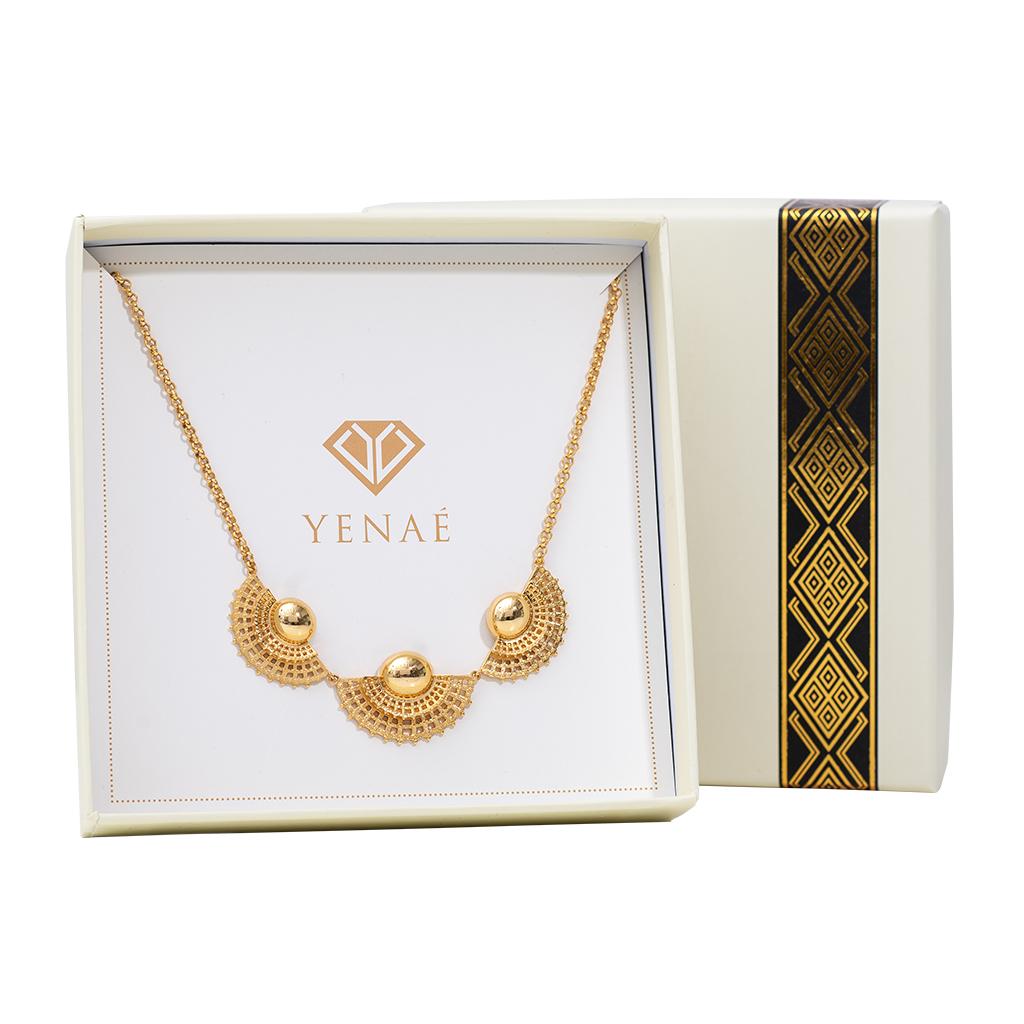 Yenaé Tsirur Statement Necklace displayed in a branded box.
