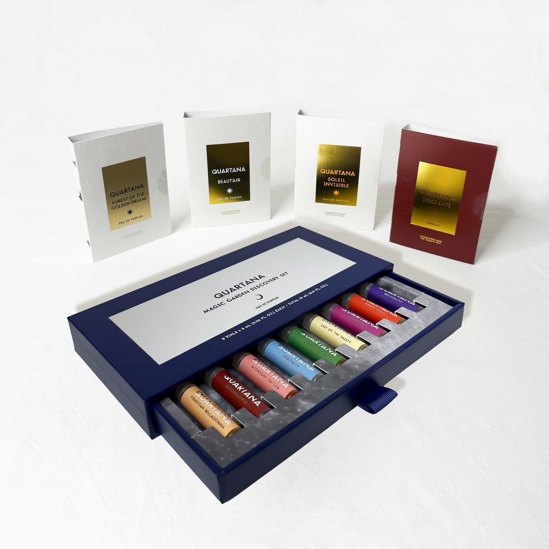 Quartana Complete Discovery Kit shown with its blue slide box and several white sample cards arranged on a clean white background.