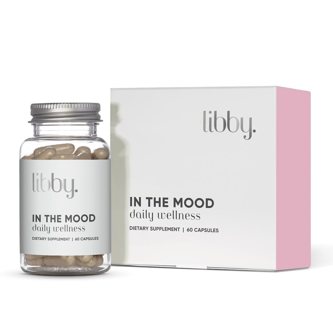 Bottle of Libby capsules next to its packaging on a white background.