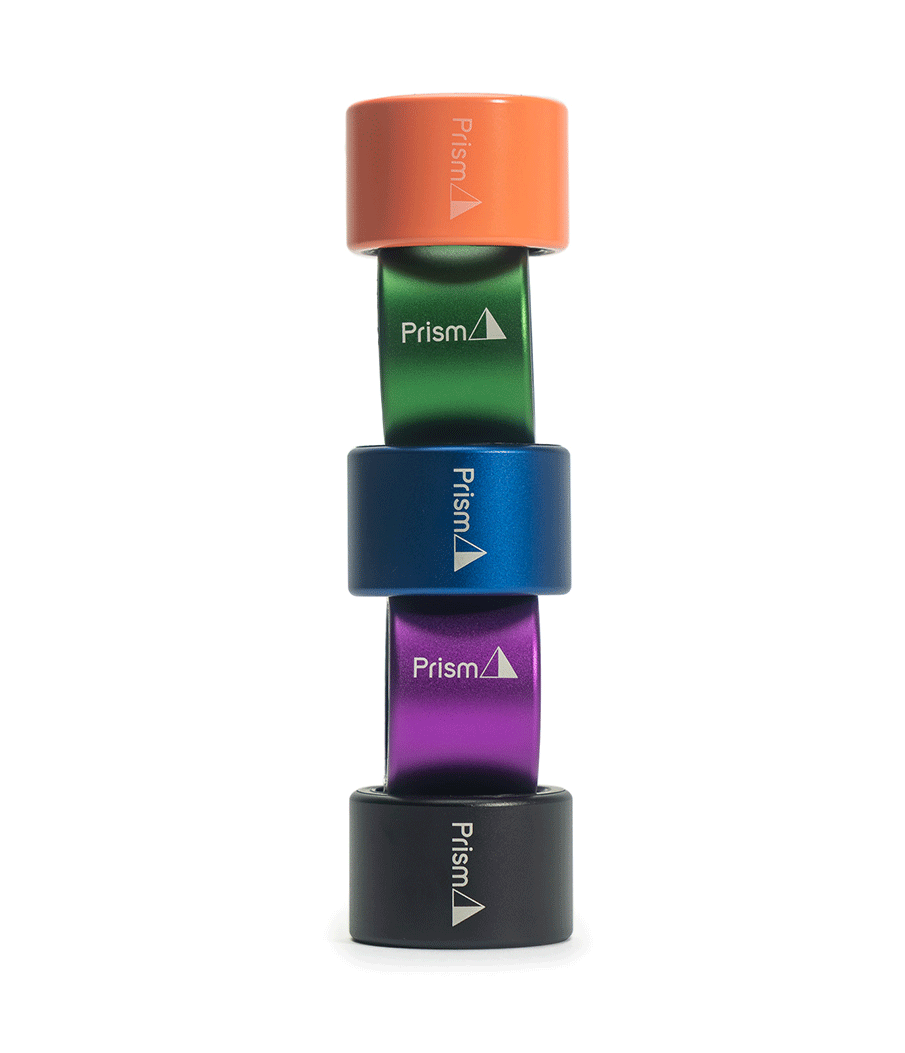 An image of a stack of Prism Halo connectors. a black, purple, blue, green. and coral halo