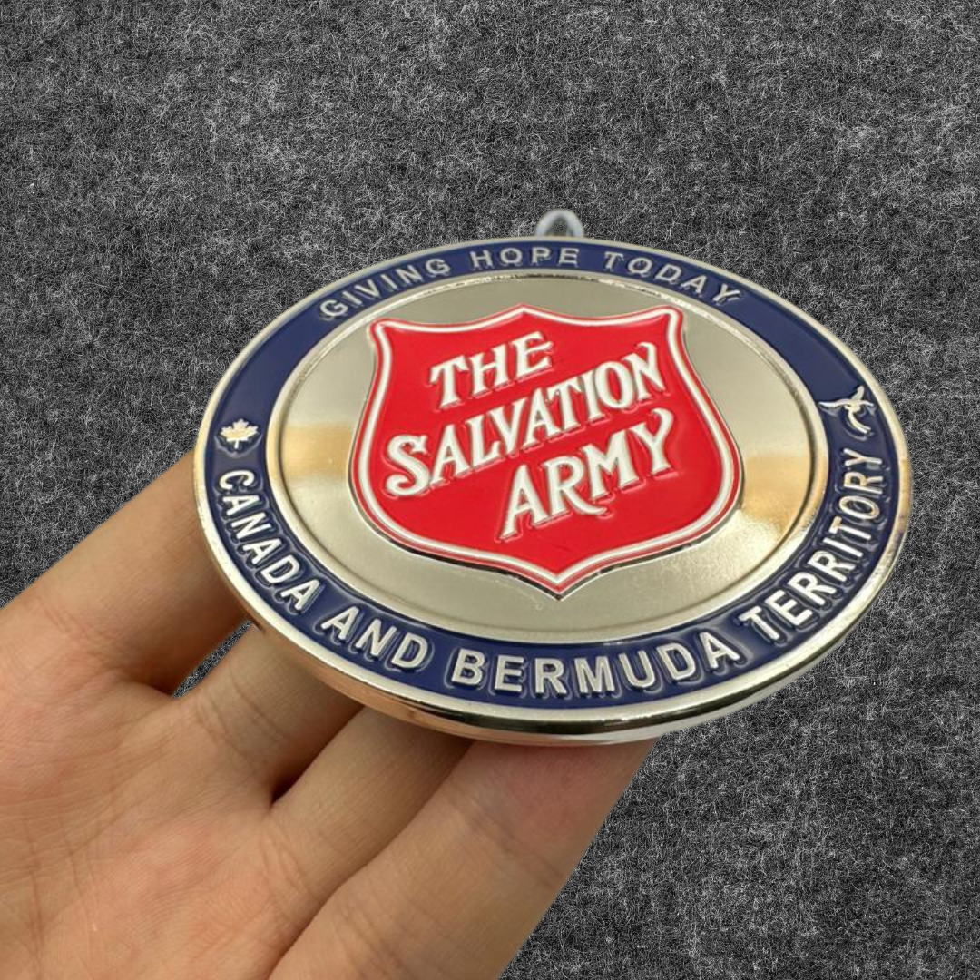 A person holding in his hands a custom challenge coin for Salvation Army non-profit fundraising campaign
