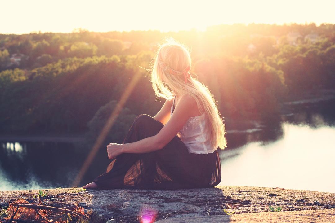 Woman looking over a river