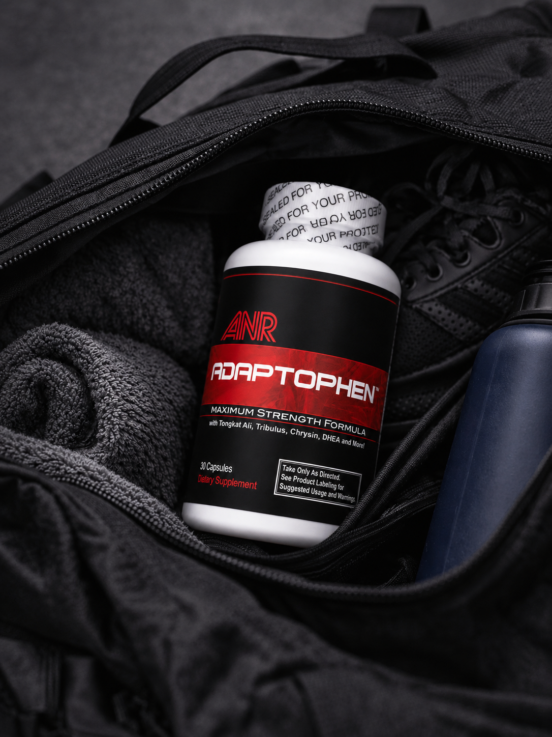 A lean, muscular man with arms crossed who uses Adaptophen to increase muscle and boost testosterone