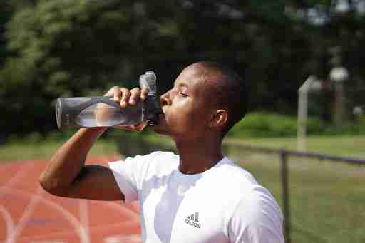 staying hydrated while running on a track outdoors