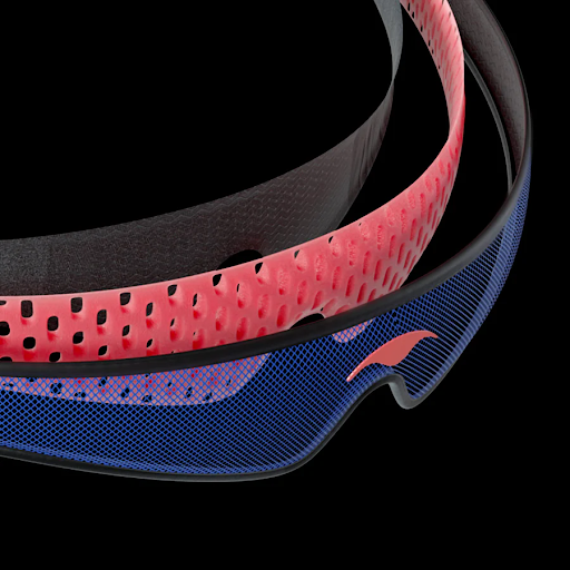 Three-layer head strap of a sleep mask for stomach sleepers. The first layer is made from mesh, the second layer is made from perforated foam and third is Tactel.