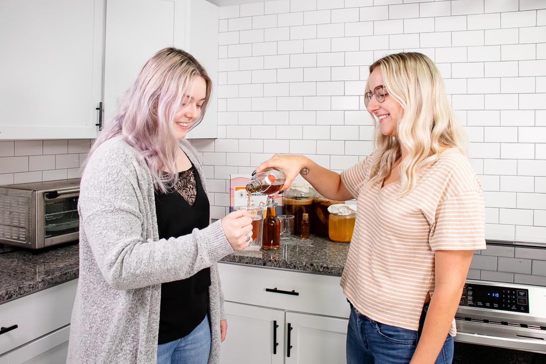 Girls enjoying a glass of komucha