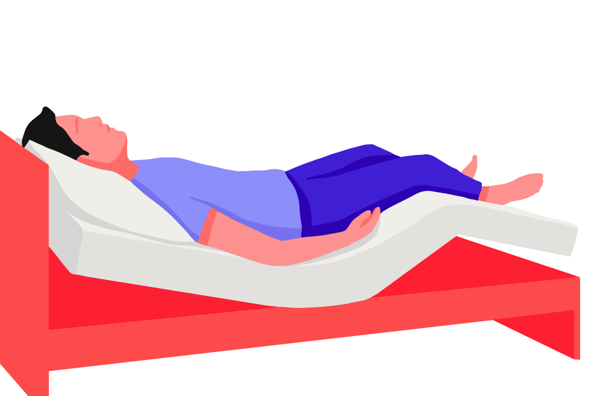 A man in the zero gravity sleep position, sleeping on an adjustable bed.
