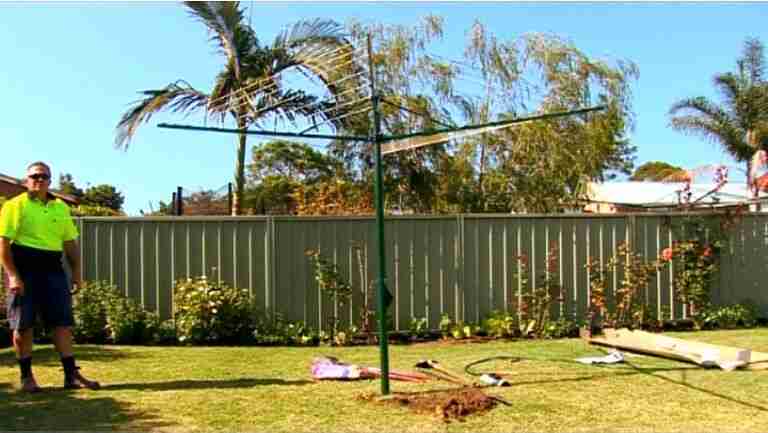 austral rotary clothesline supply and installation with clothesline installed into grass area
