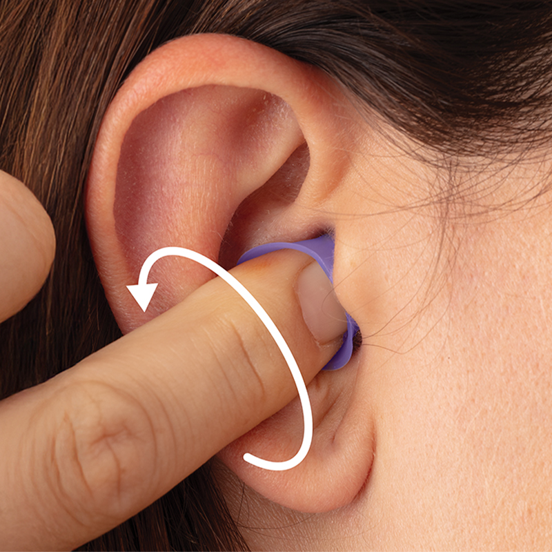 A person twisting an earplug into their ear with an arrow indicating the correct positioning.