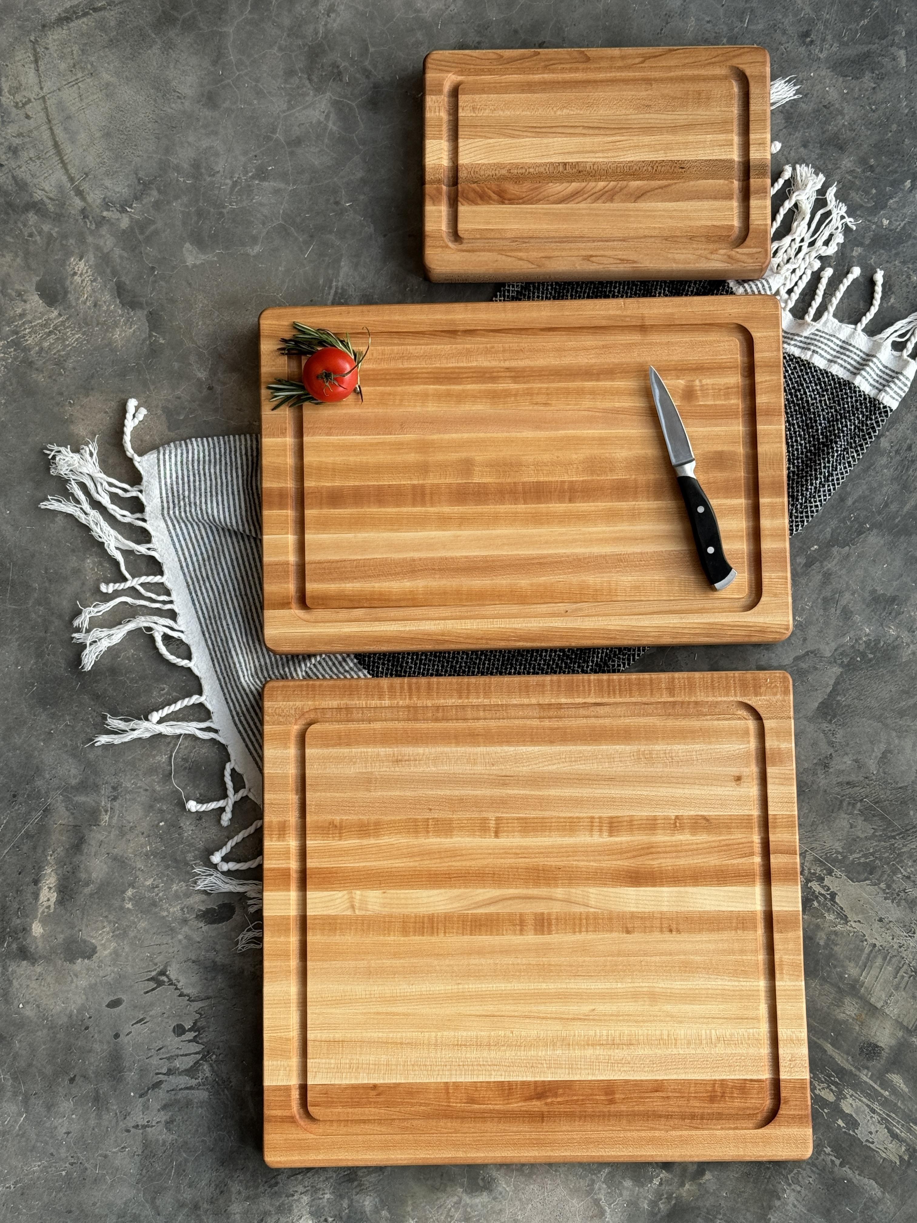 Three sizes of maple cutting boards offered by roots to table.