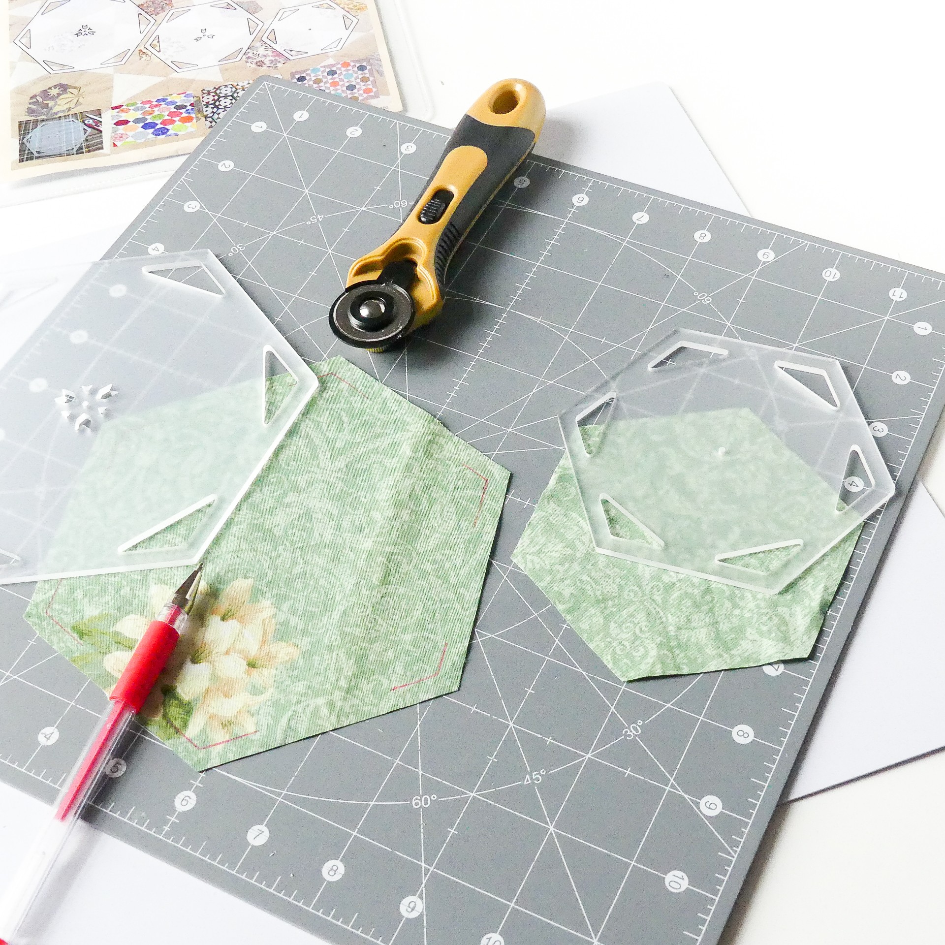Showing marked lines after using the triangular seam allowance slots in hexagon quilt templates.