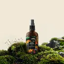 product bottle placed on a grassy patch