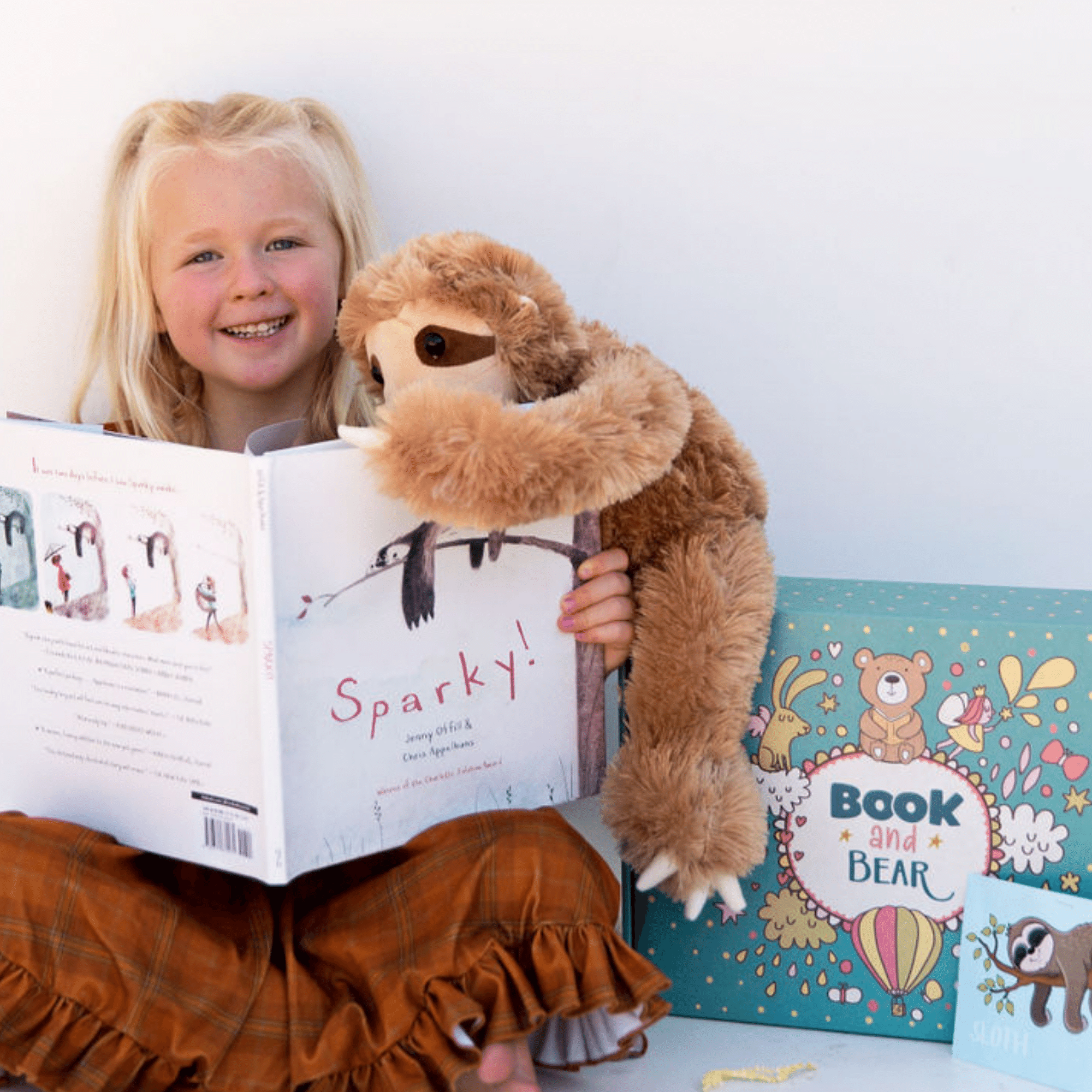 Girl With Holiday Book and Bear box