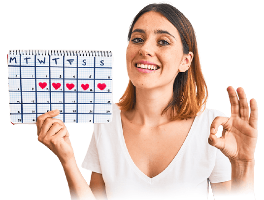 femme qui tient un calendrier menstruel