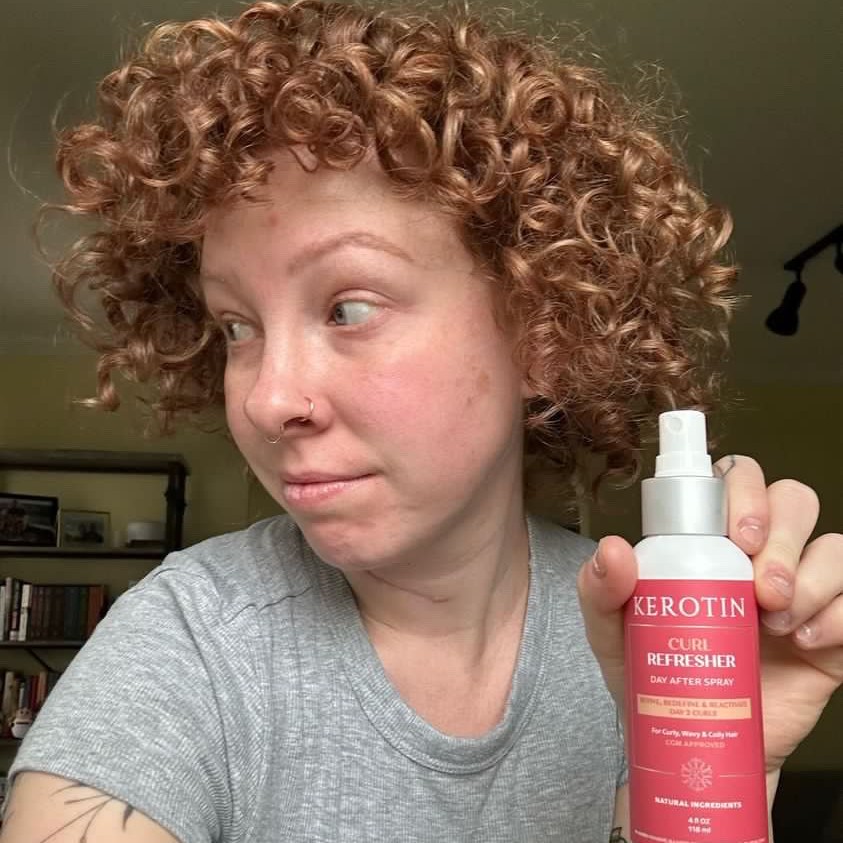 Curly hair woman with curl refreshing spray