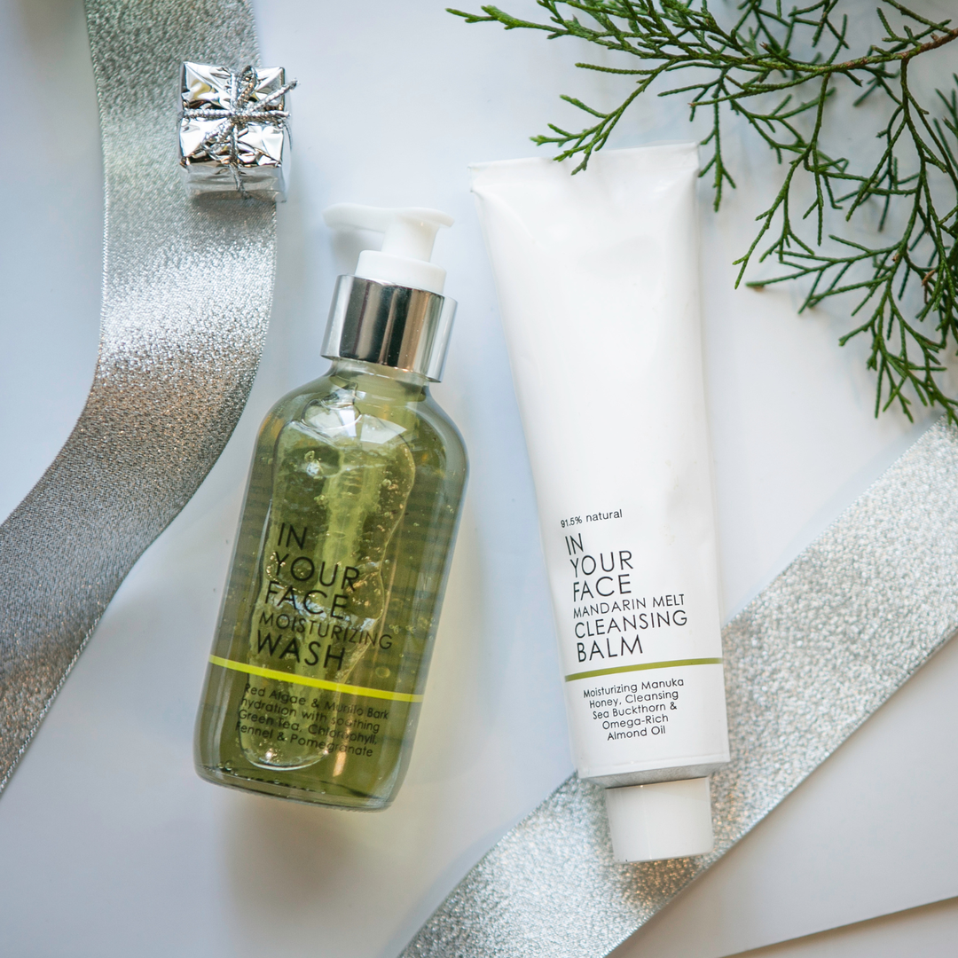 the DOUBLE CLEANSE DUO next to a towel on marble.