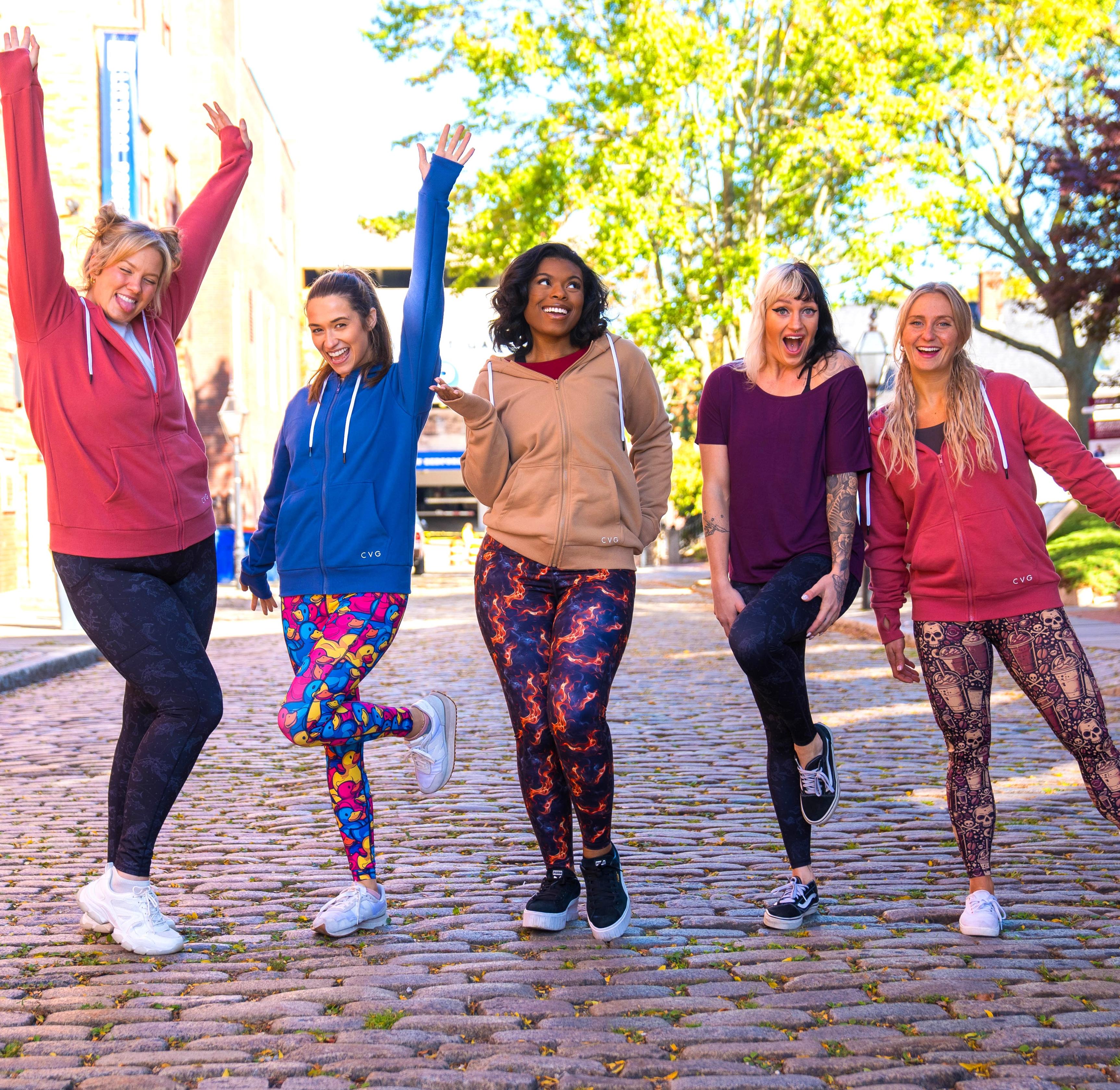 close up of the cat patterned leggings, the paw print patterned leggings and the dog patterned leggings