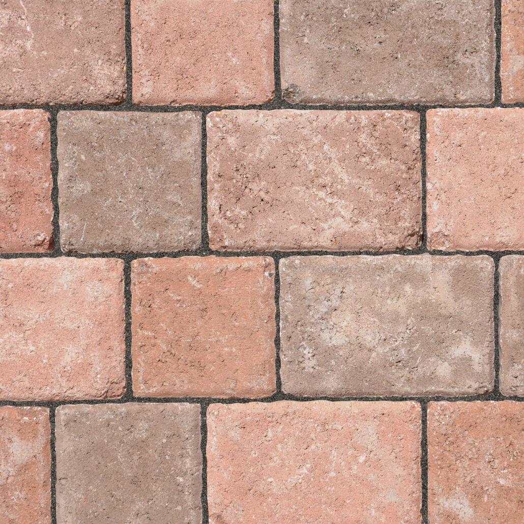 Charcoal polymeric sand inside the joints of warm red pavers