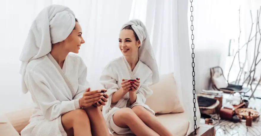 two woman in robes at spa