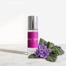 Mandrake 10mL eau de parfum bottle by PARFUMS QUARTANA on white with flower
