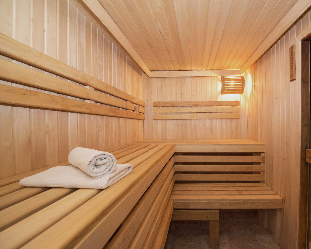 a sauna with a towel on bench