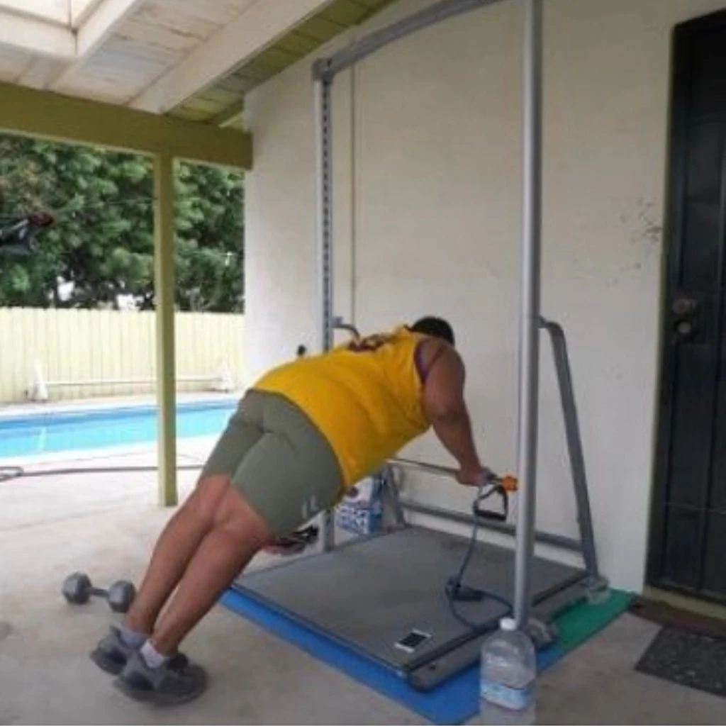 heavy duty high quality pull up and push up adjustable bar and dip station with man doing assisted push up