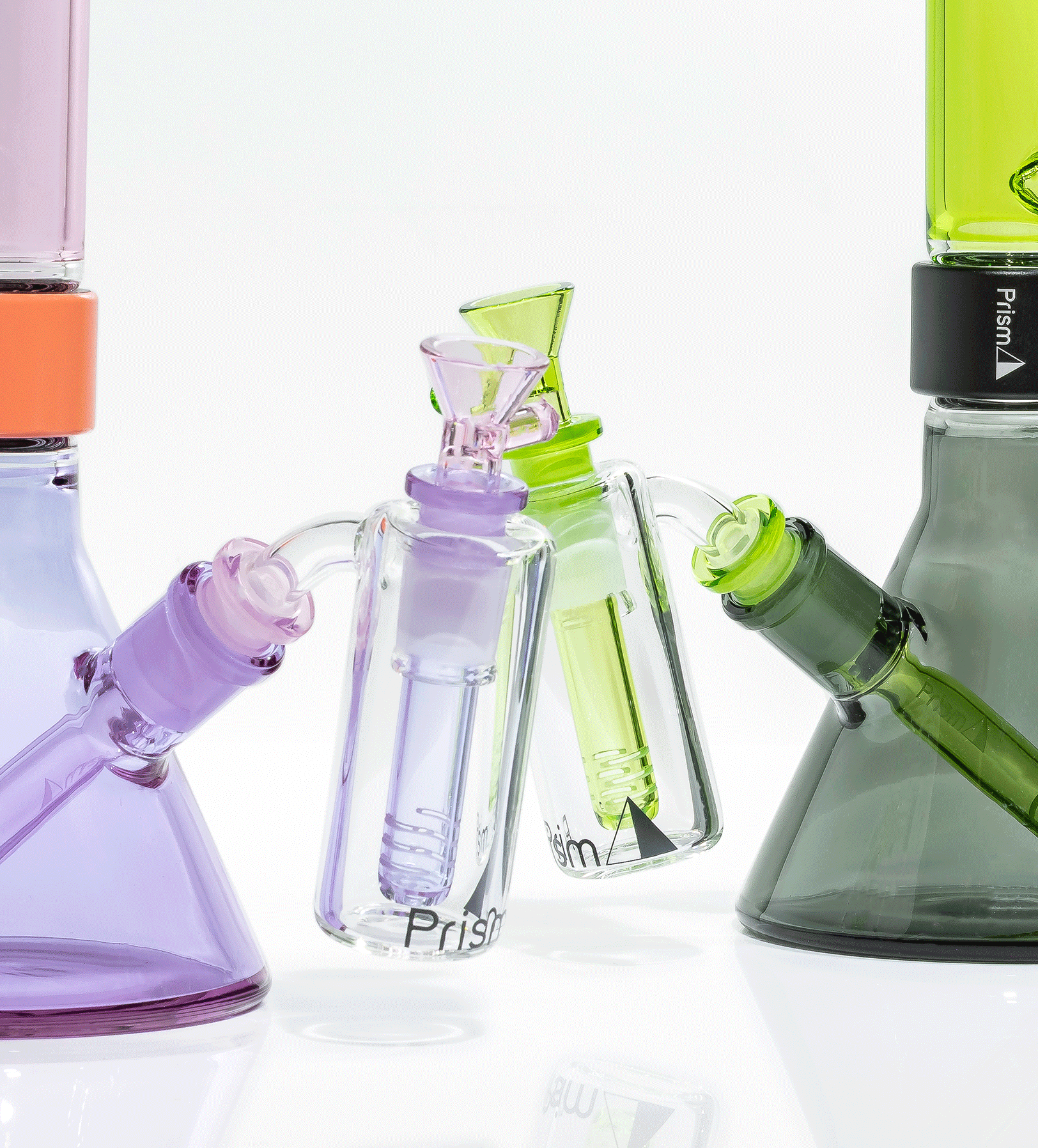a closeup image of two Prism duo bongs with corresponding glass ash catchers