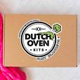 a large dutch oven kits logo sticker on a brown box. dutch oven kits fart blankets