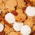 white and brown small cookies with pecans and cinnamon sticks